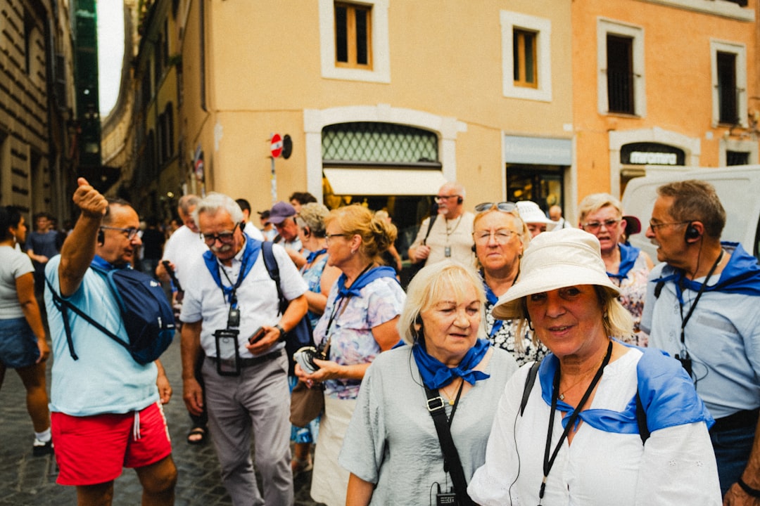 diverse tourist group listening to guide