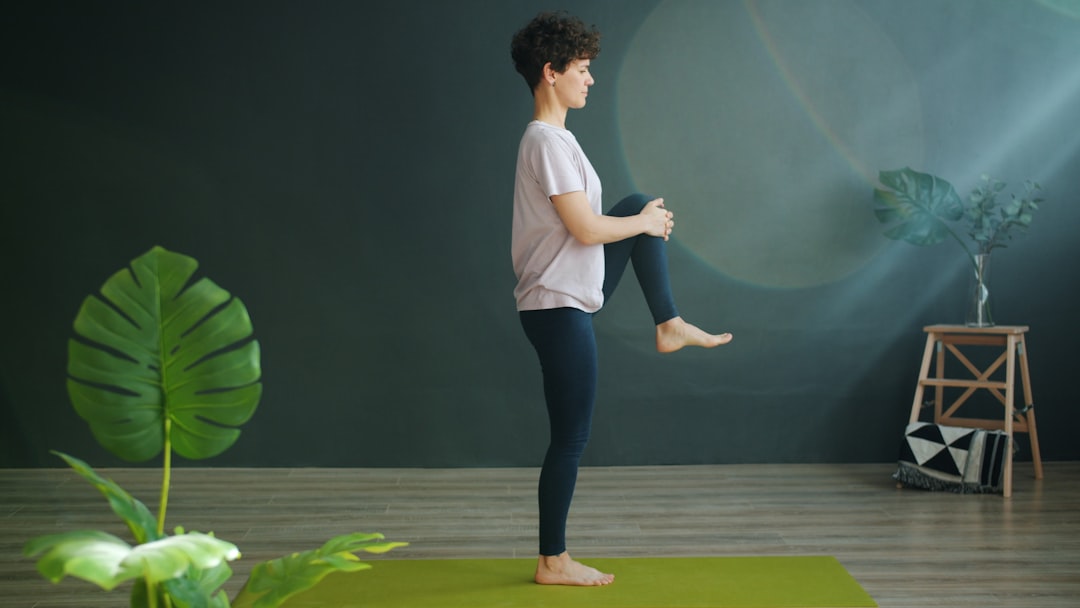 person meditating on yoga mat
