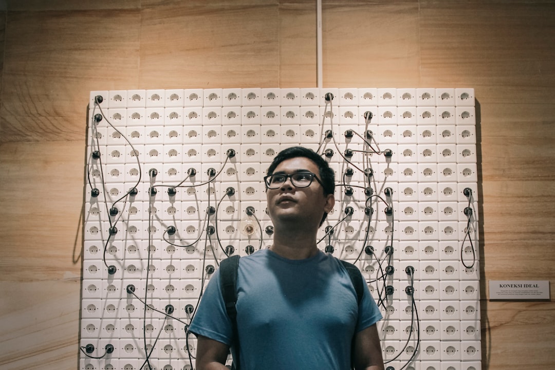 teacher helping visually impaired student