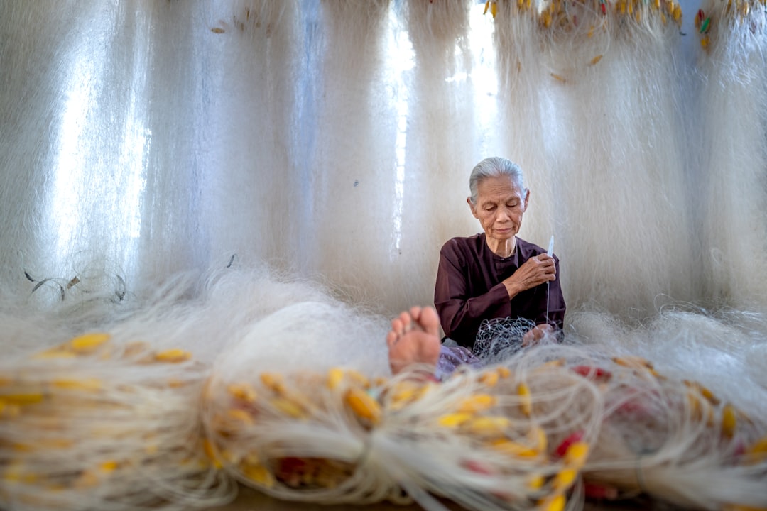 weaver working with yarn