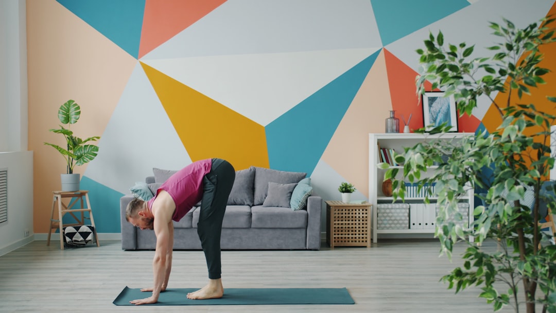 woman practicing yoga at home