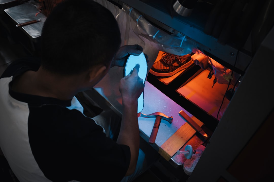 astronaut working with computer inside spacecraft